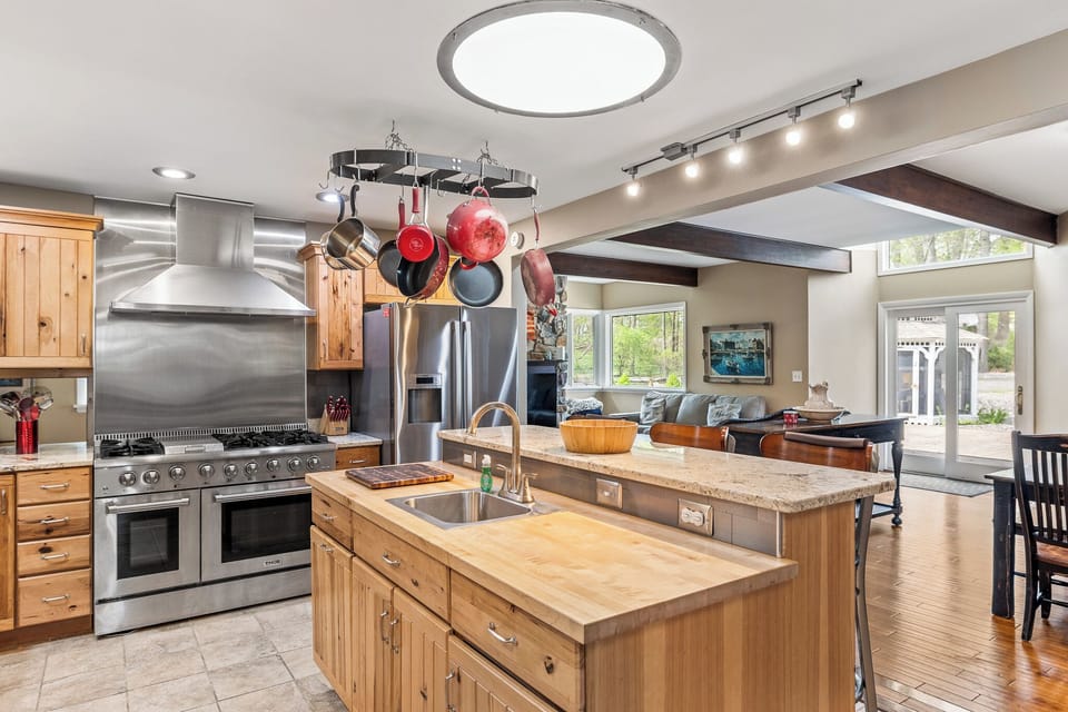 Kitchen View to Living Room and Dining Area 
