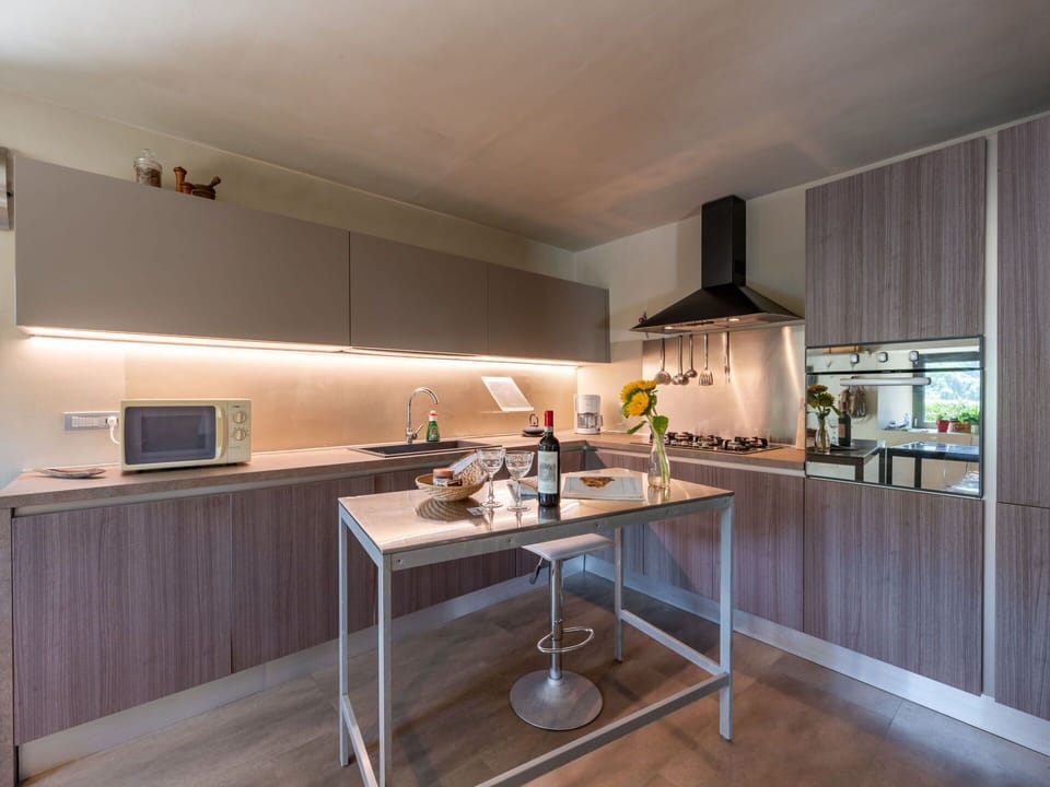 Kitchen, Countertop, Interior Design, Kitchen Appliance, Cabinetry, Major Appliance, Furniture, Ceiling, Light Fixture, Flooring