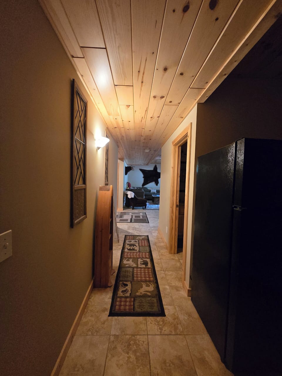 Hallway from bedroom #1 & kitchenette to bathroom, den, living room.