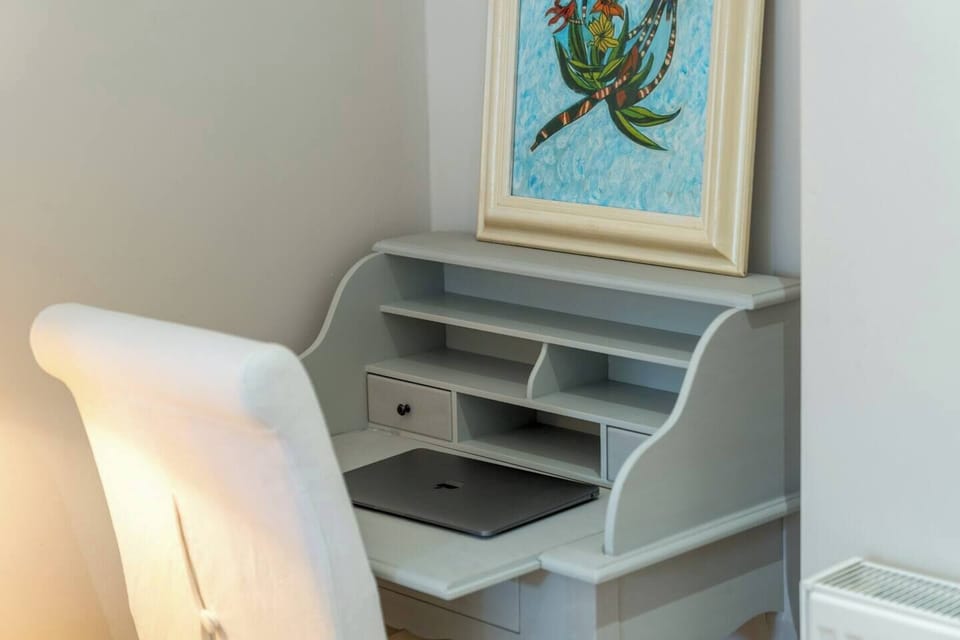 Discover a small study table and working area designed to cater to your professional needs. Whether you're catching up on work or studying, our thoughtfully arranged study table ensures you can focus and maximize your efficiency. 