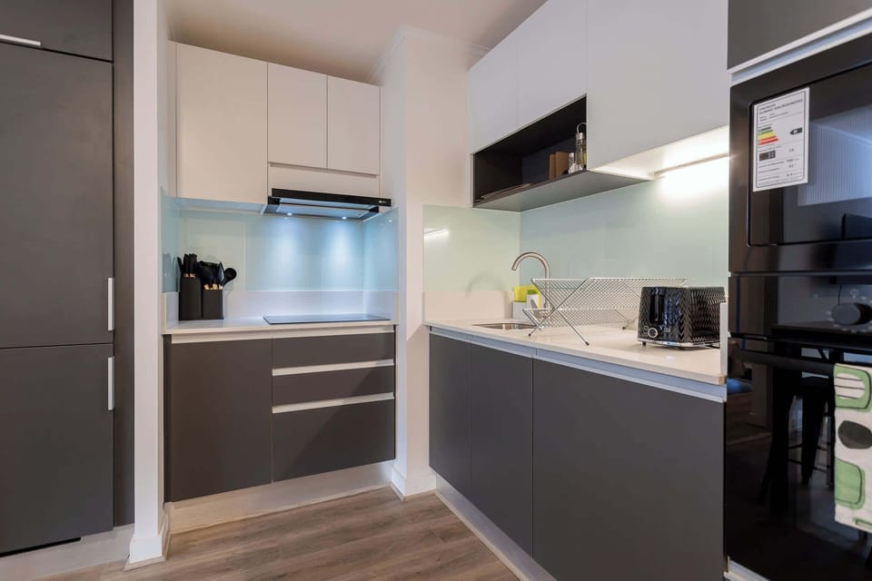 Experience a sleek, modern kitchen equipped with high-end appliances and stylish finishes, perfect for your culinary adventures.