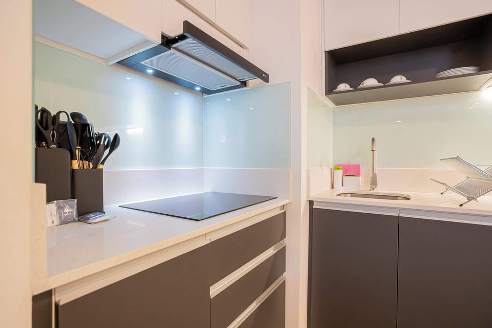 Sleek and modern kitchen with top-notch appliances, perfect for culinary enthusiasts seeking style and functionality.