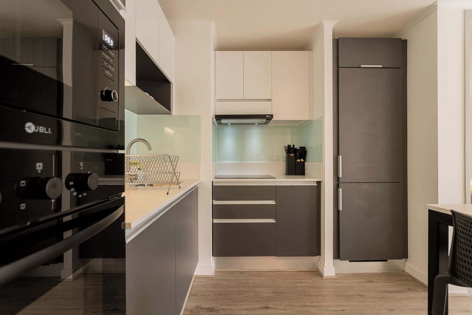 Sleek, modern kitchen with top-notch appliances and stylish design, perfect for culinary adventures.