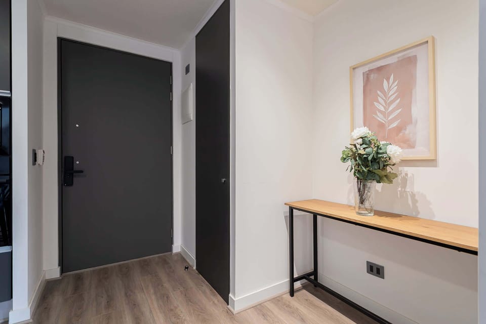 Welcome to your stylish retreat with a chic entrance featuring elegant decor and a welcoming vibe.