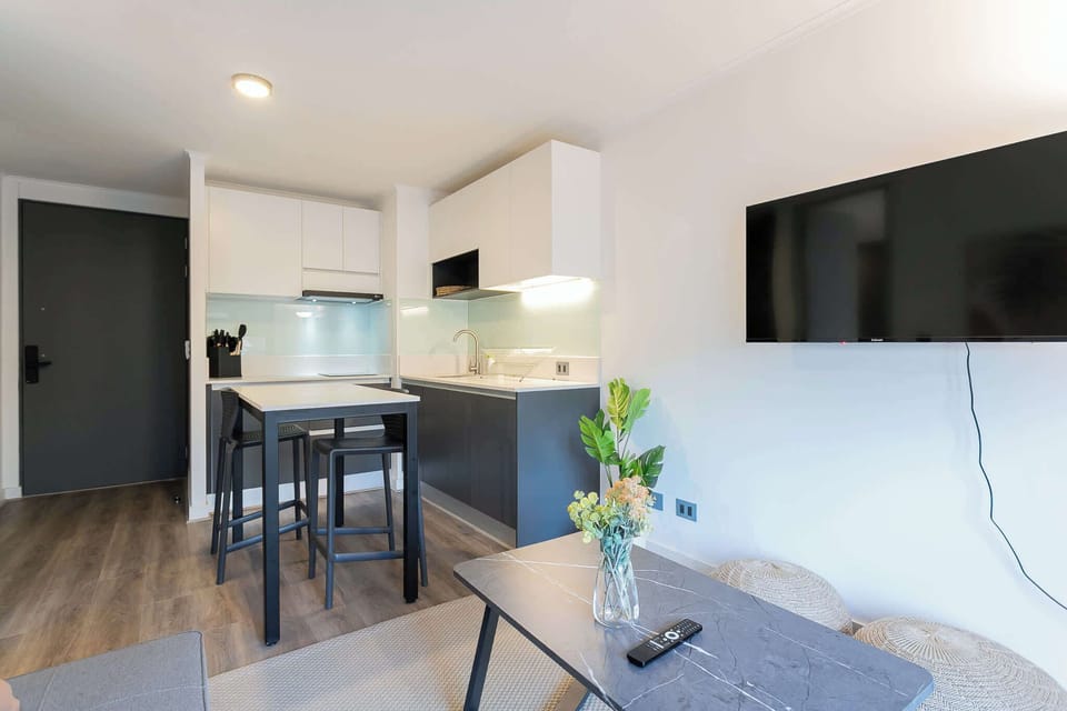Chic and modern kitchen with dining area, perfect for cozy meals and relaxation.