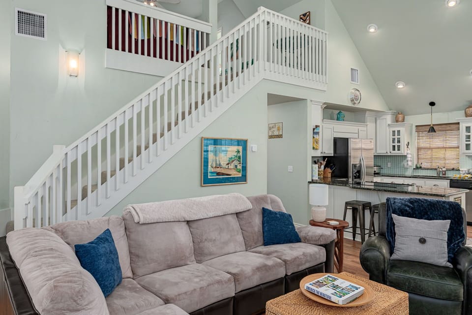 Stairs lead to loft bunkroom