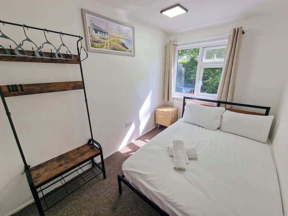 Second view of the bathroom showing the full layout with bath, fresh towels ready and waiting for your arrival