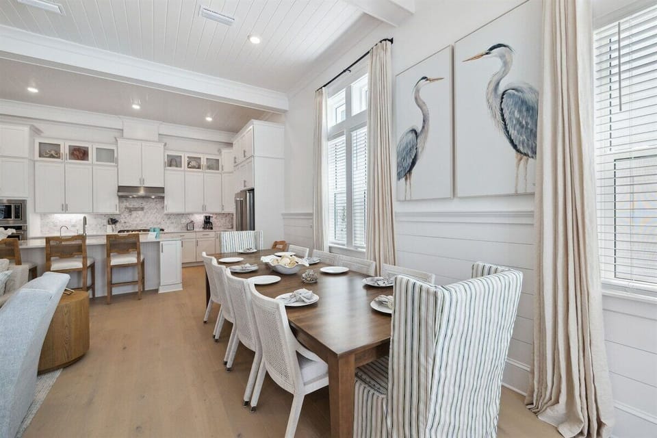 Dining table with seating for six. Kitchen island with additional seating for three.