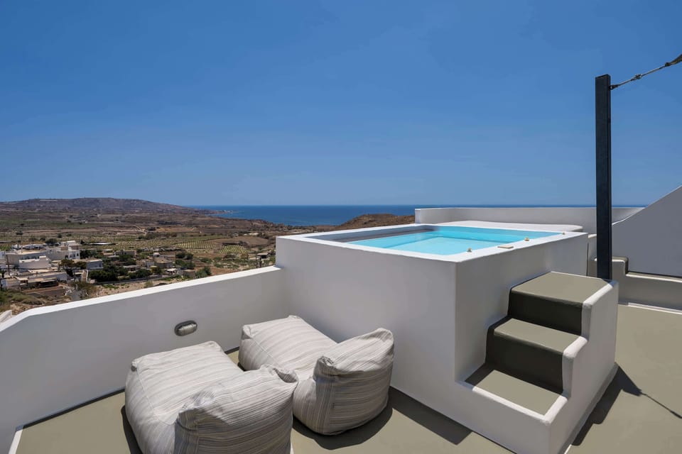 Panoramic View from the Private Jacuzzi Area
A relaxing space with cushioned seating and a direct view of the sea and surrounding landscape.