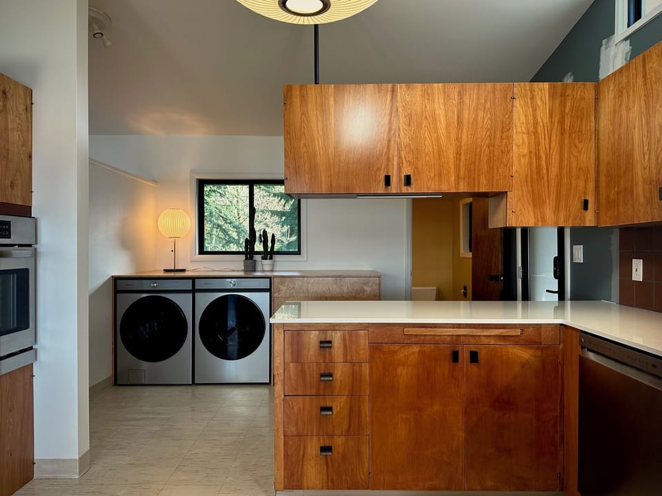 Full kitchen half bath and laundry