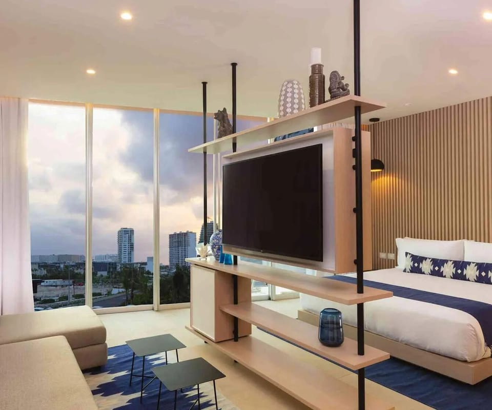 Spread out in the stylish open-plan suite with media wall.