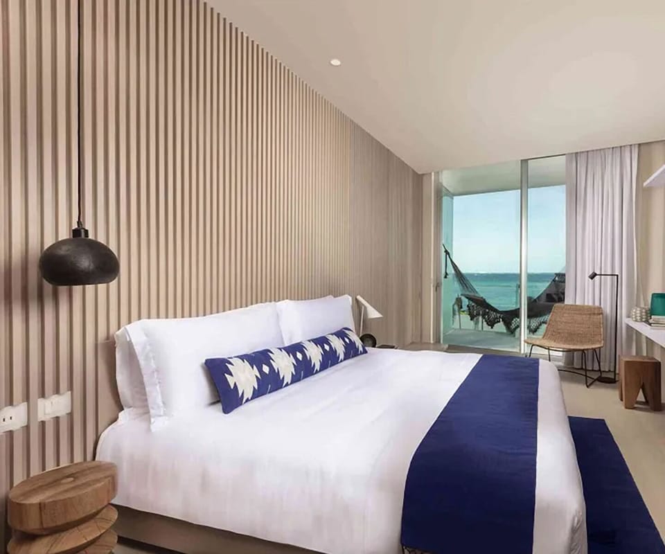 Sink into crisp bedding with soothing ocean views.