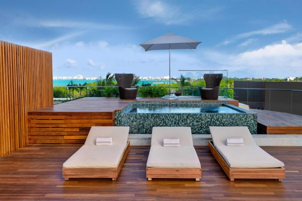 Soak in the rooftop plunge pool with skyline views.