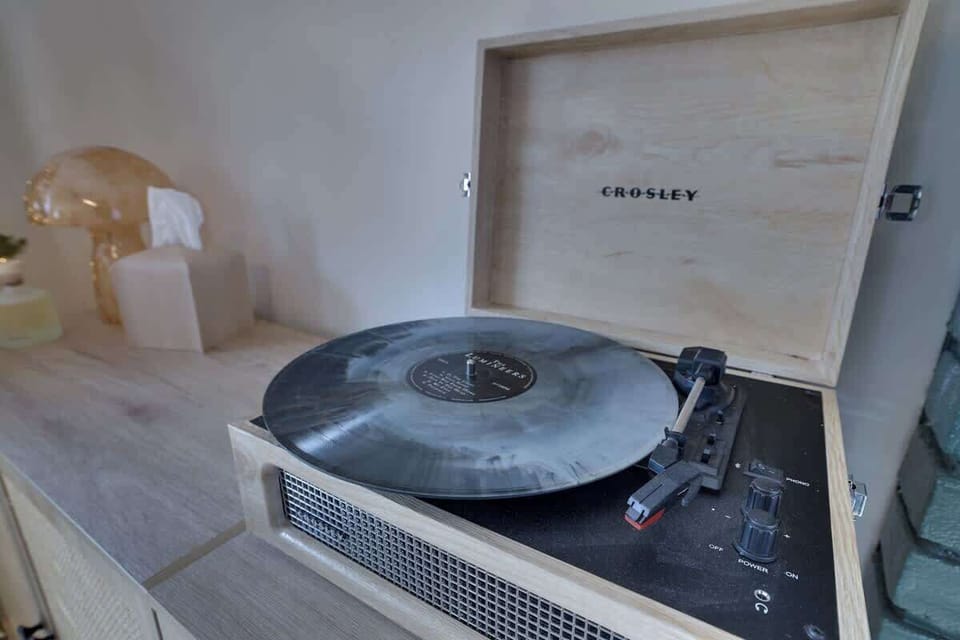 Record Player Retreat: Spin your favorite tunes and unwind in style during your getaway!