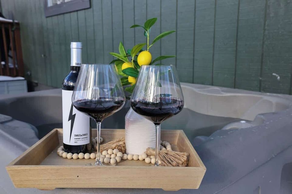 Private Hot Tub Retreat: Sip wine while soaking in luxury—your perfect getaway awaits!