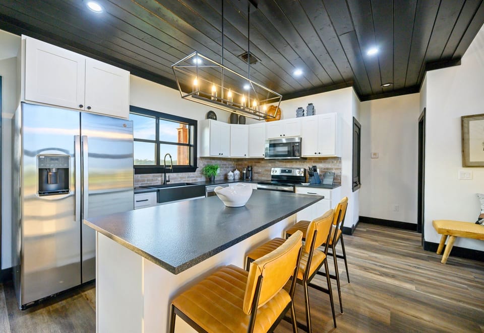 With modern stainless appliances, stylish finishes, and tons of workspace, this kitchen is ready for everything from full family dinners to casual late-night snacks.