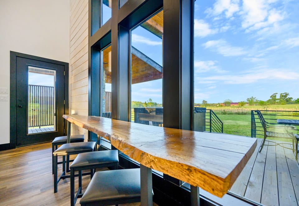 Gather around the live-edge wood dining table to share delicious meals, competitive board games, and all the stories that come with making new memories.