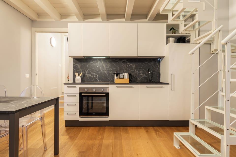 The full kitchen (with Nespresso machine, microwave, oven, kettle, juicer)