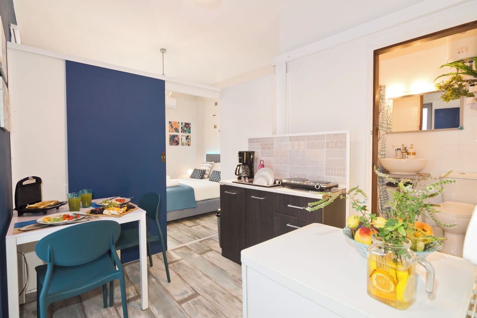 Kitchen Overview with Bedroom Area in the background.