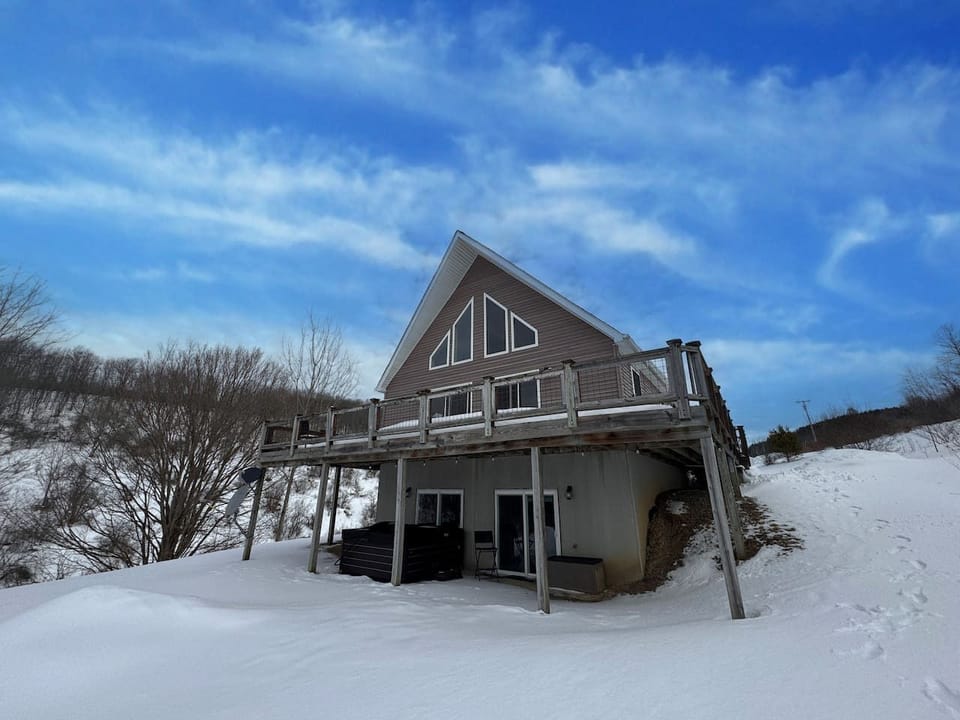 Exterior: Mountaintop chalet with a wraparound deck