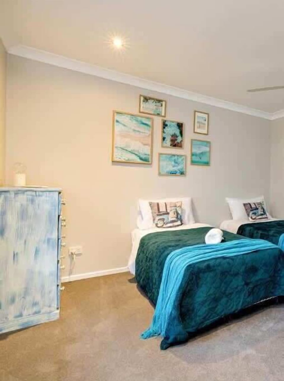 Ideal for children or friends travelling together, the fourth bedroom offers two single beds in a comfortable and welcoming environment.
