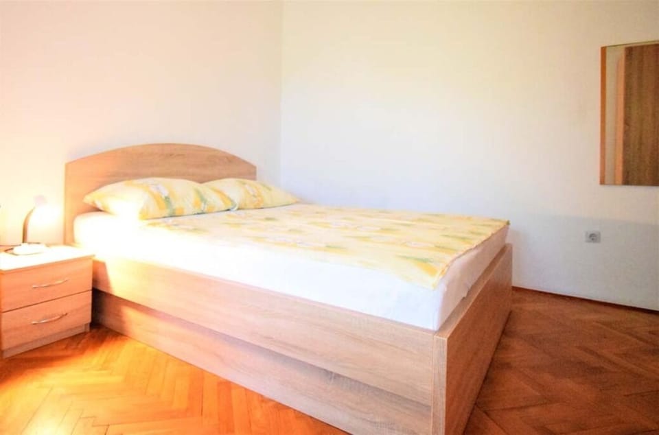 Bright bedroom with comfortable double bed.