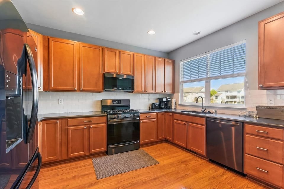 Large eat in Kitchen, Gas stove, dish washer, frig with ice maker, coffee pot, toaster, plate, cup utensils, pot and pans ect...Everything you need for meals, Games in the closet, card in basket against wall 