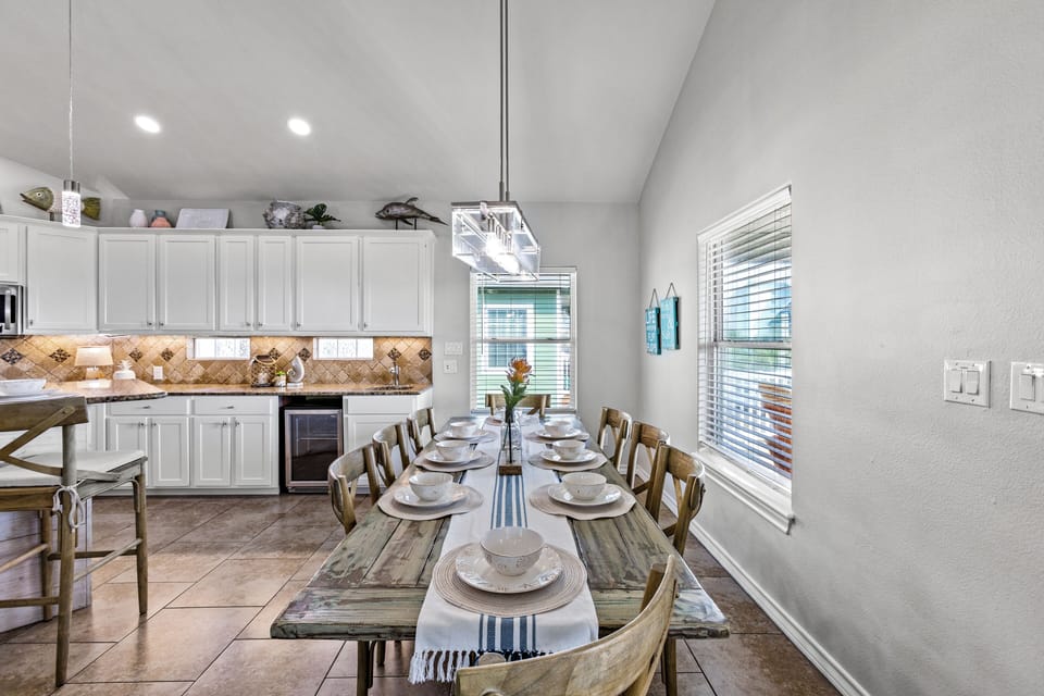 Gather around the rustic table for unforgettable meals and beachside stories!