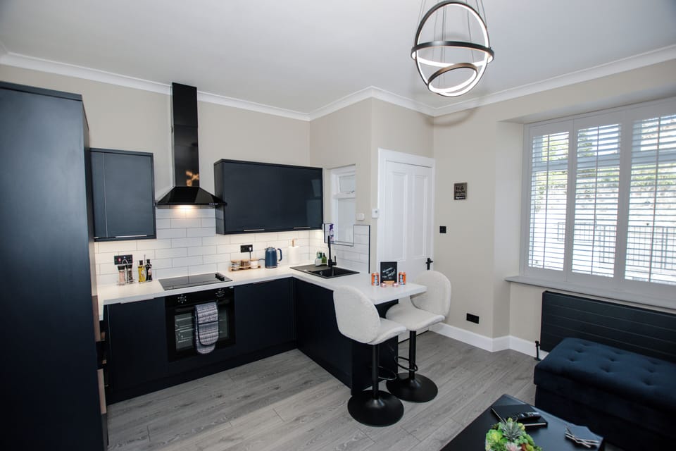 Picture yourself cooking here — navy tones, brand new in April 2025