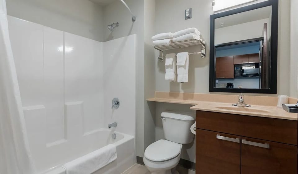 Refresh with a bright, spotless bath and fresh towels ready.