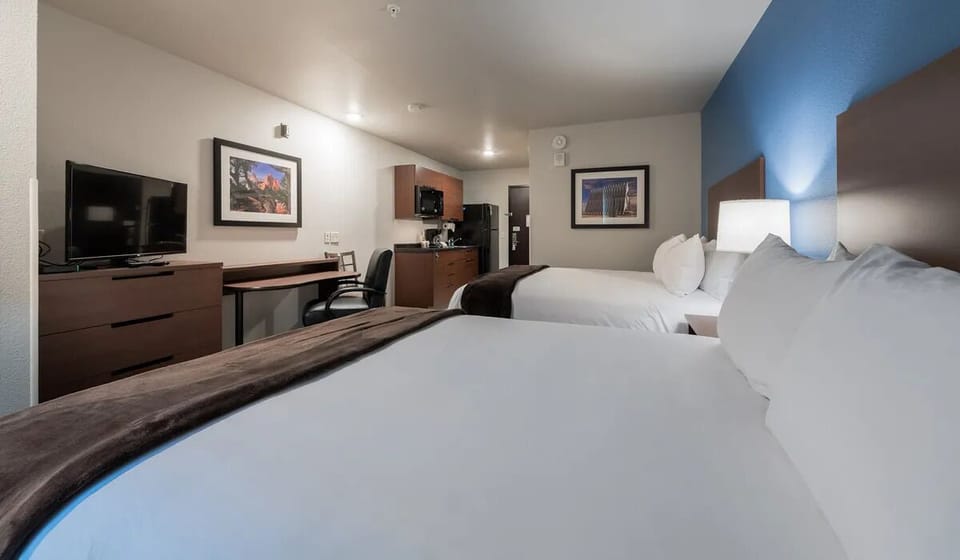 Spread out comfortably in a spacious room with two plush beds.