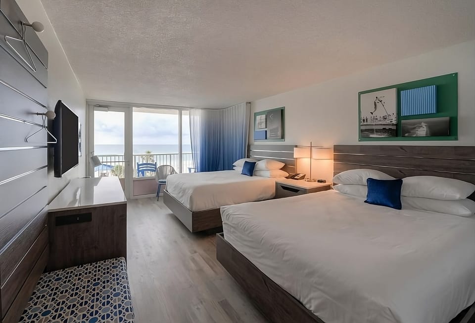 Unit with 2 Queen beds. Exact unit will be assigned upon arrival. Views, colors, and decor may vary.