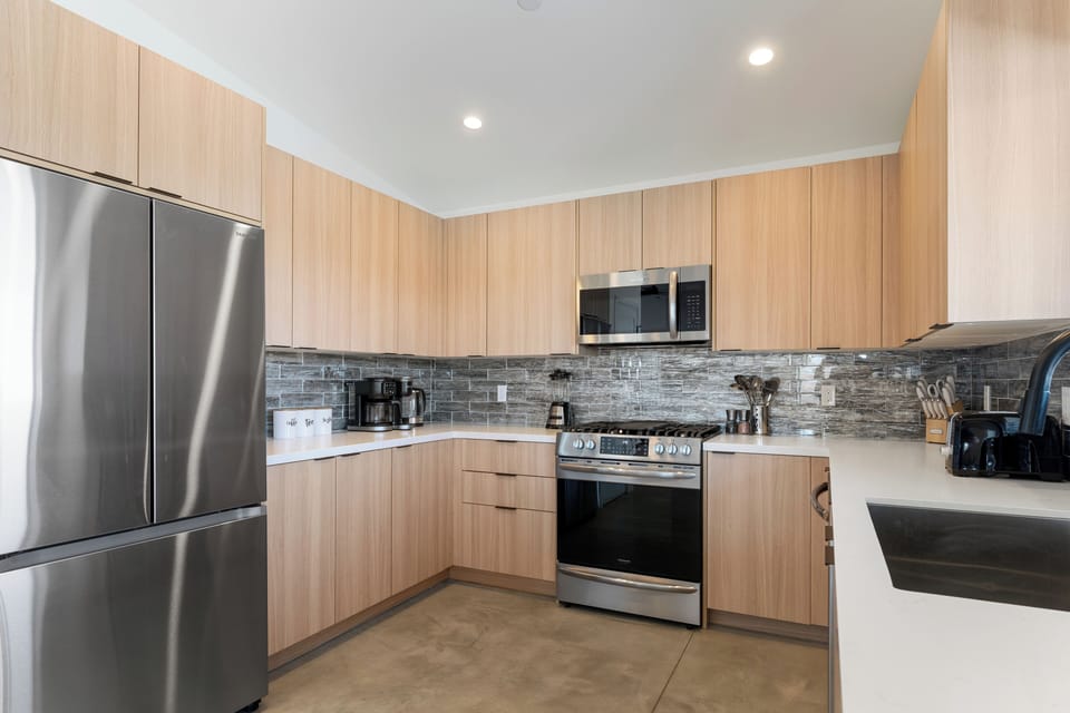 Stylish, functional kitchen with stainless steel appliances.