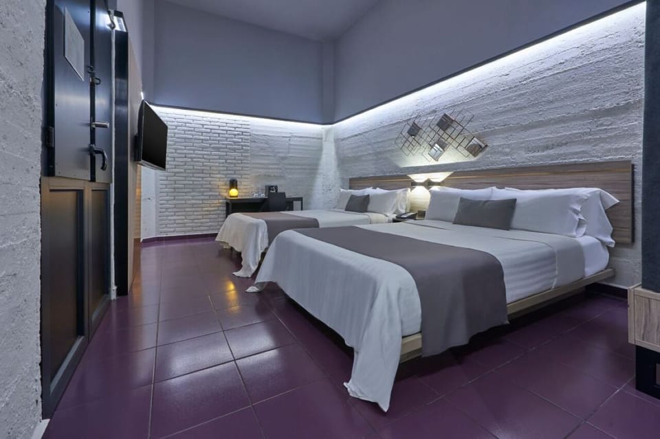 Drift off on plush bedding in a serene, minimalist space.