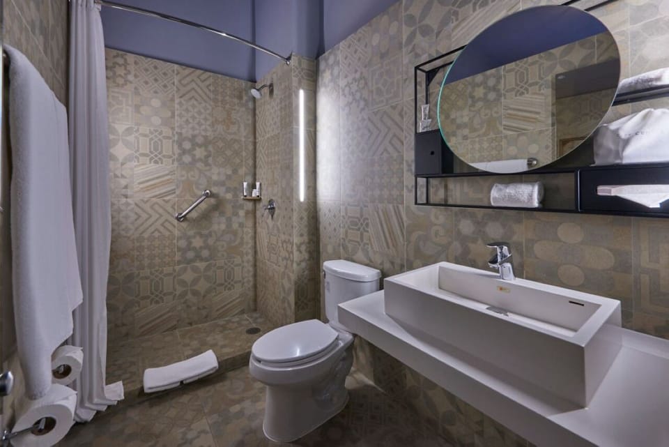 Refresh in a bright, modern bath with spacious walk-in shower.