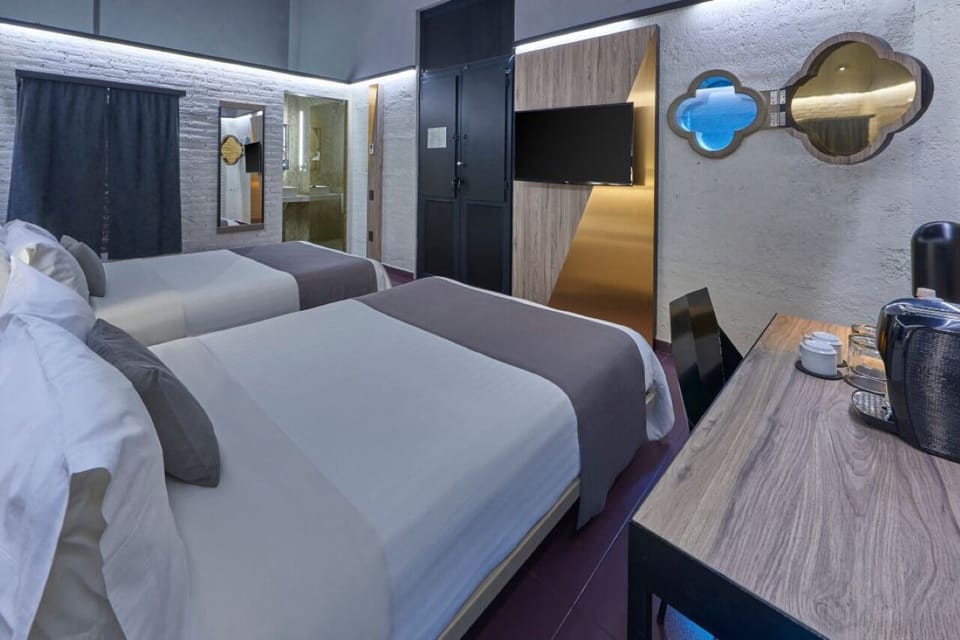 Settle in with in-room coffee, cozy beds, and chic accents.