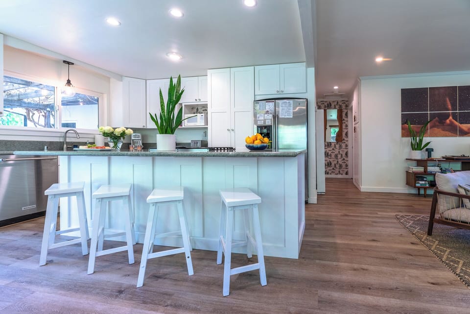 To the right of the kitchen is the small hallway leading - to the bedrooms and bath.