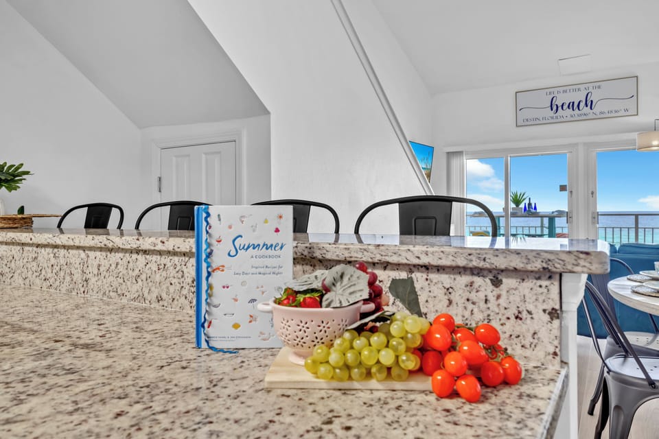 Your gourmet kitchen features granite countertops and stunning ocean views, perfect for preparing fresh meals while enjoying the coastal breeze.