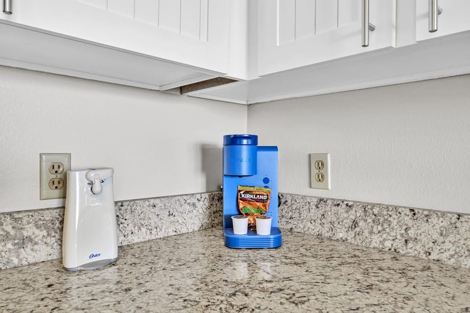 Brew your perfect cup with the convenient Keurig coffee maker on beautiful granite countertops.