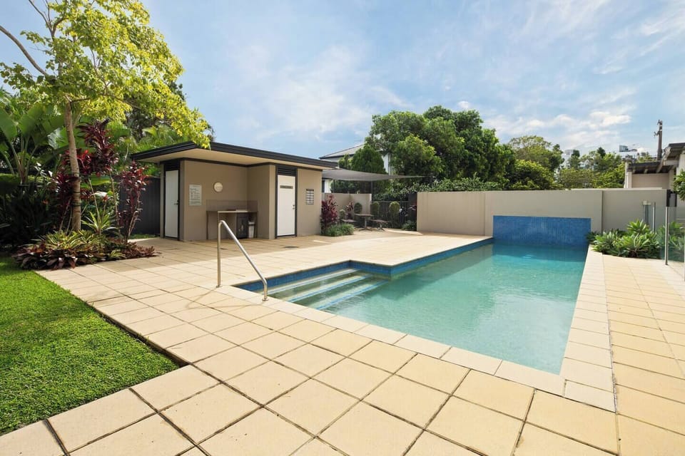 Cool off or warm up in the outdoor heated pool, surrounded by lush greenery and perfect for a relaxing dip after a day by the Broadwater.
