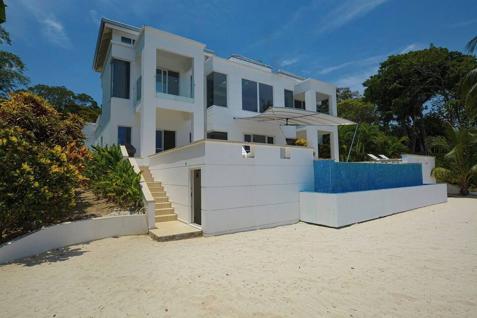 Steps from the house directly onto a large area of private beach garden.