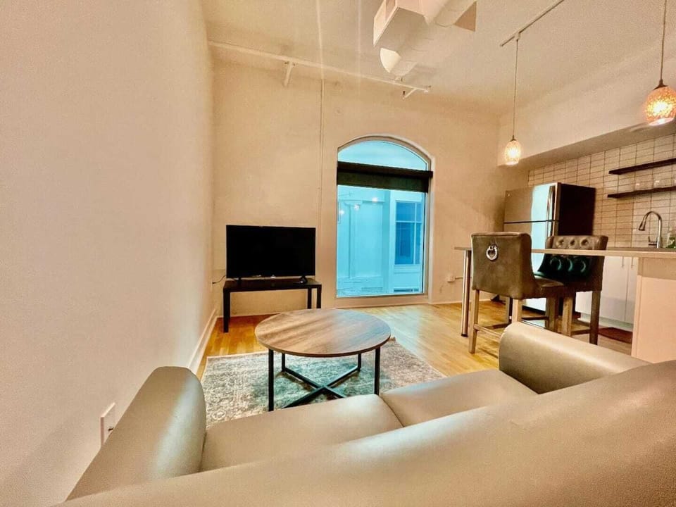 Loft 506 living room area, with fully stocked eat-in kitchen
