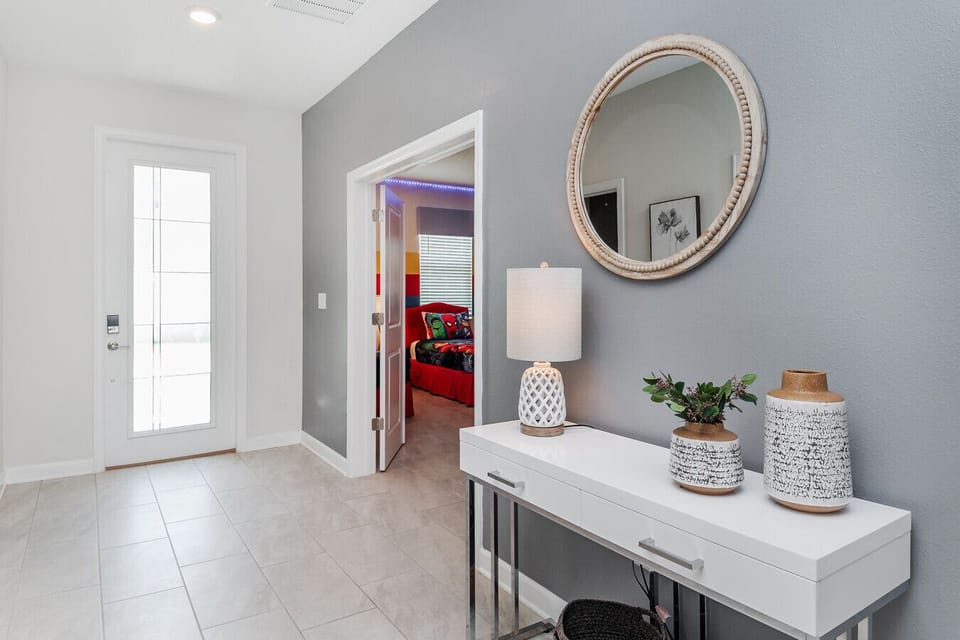 Welcoming Entryway – Bright and modern space with chic décor, offering a warm welcome as you enter the home.