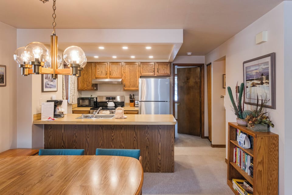 Cook your favorite meals in this fully equipped kitchen with modern appliances and spacious counters for easy meal prep.