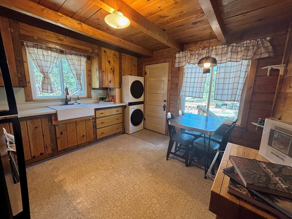 Kitchen view with sink and washer/dryer