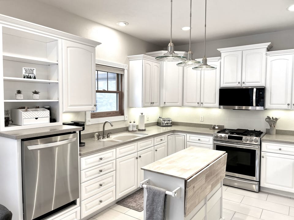 Clean, cozy and organized kitchen with labeled drawers/cupboards + a DUO Keurig 