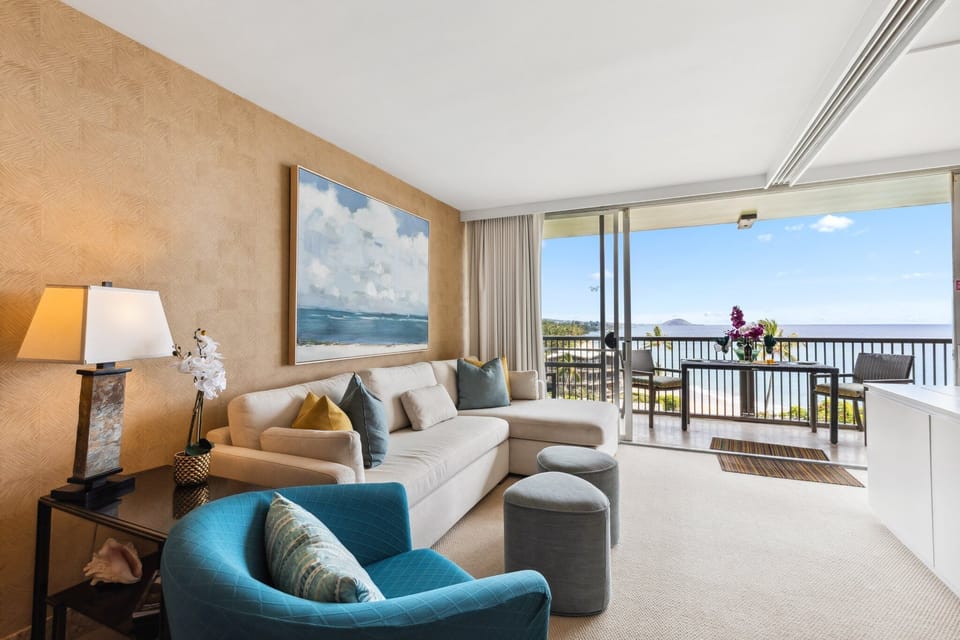 Relax in the stylish living room with comfortable seating and stunning ocean views right from the sofa.