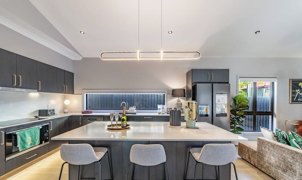 A sleek and functional kitchen island providing a perfect centerpiece for this modern home.