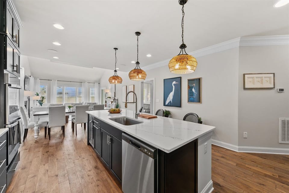 Open concept kitchen that leads into the dining room and living room area.