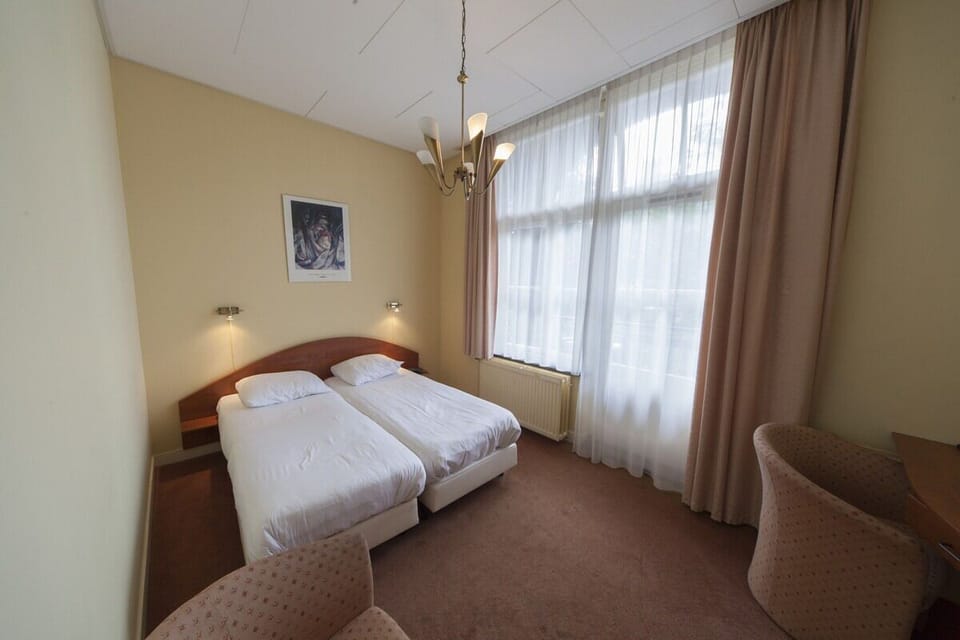 Unit with 2 Single beds. Exact unit will be assigned upon arrival. Views, colors, and decor may vary.